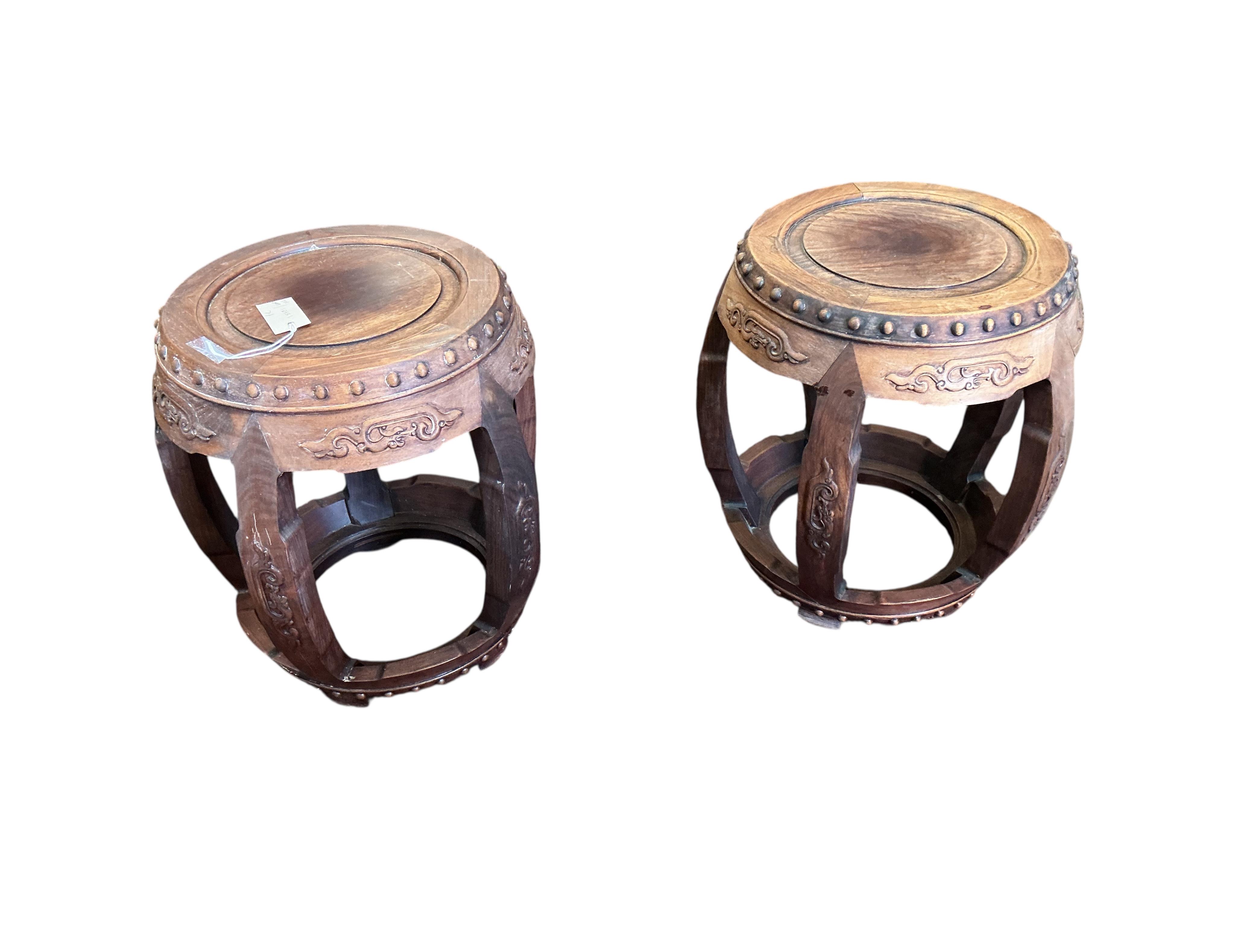 A pair of Chinese circular hardwood jardiniere stands, diameter 42cm, height 46cm